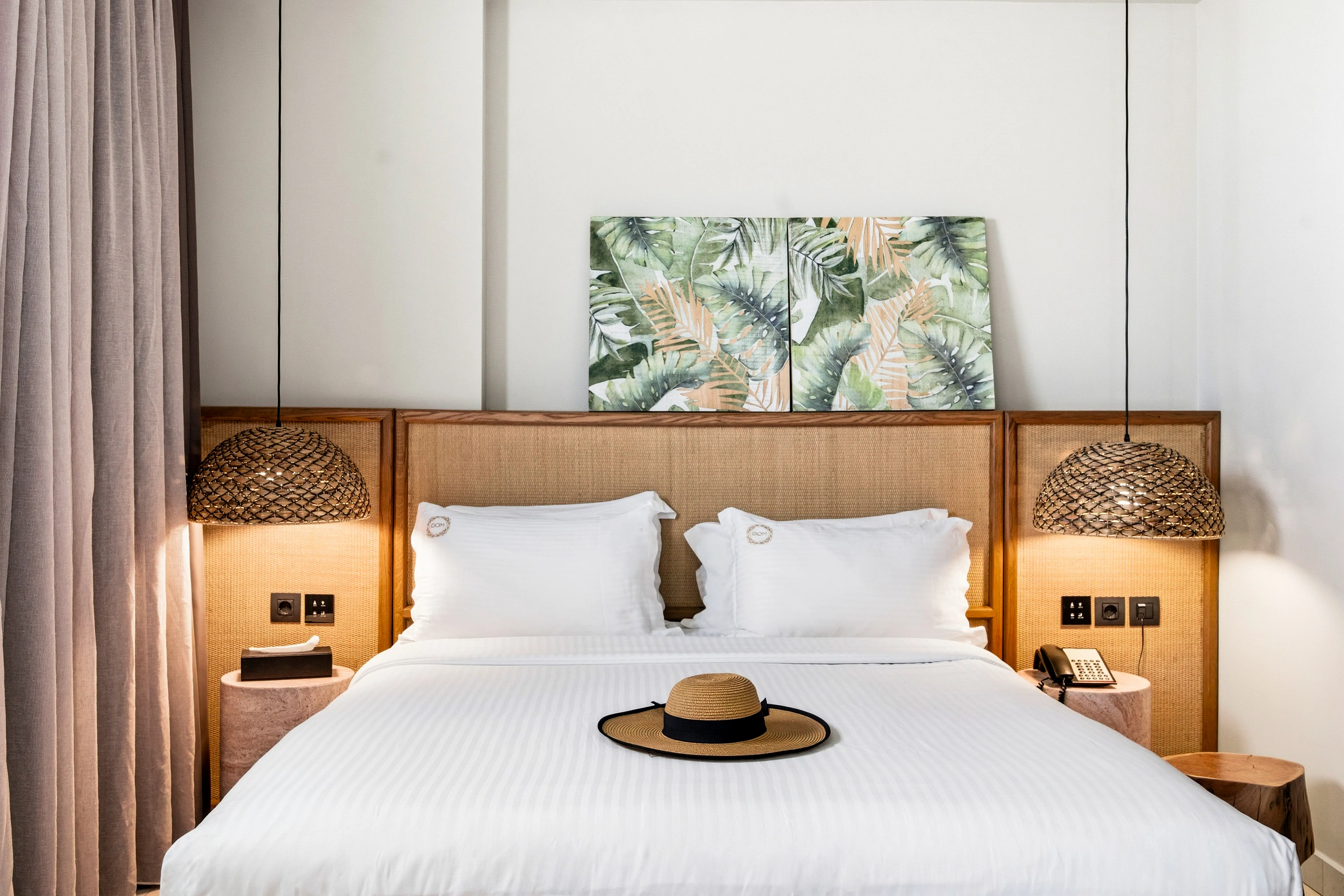 The Junior Suite's private terrace, with loungers, a hanging chair and the hot tub